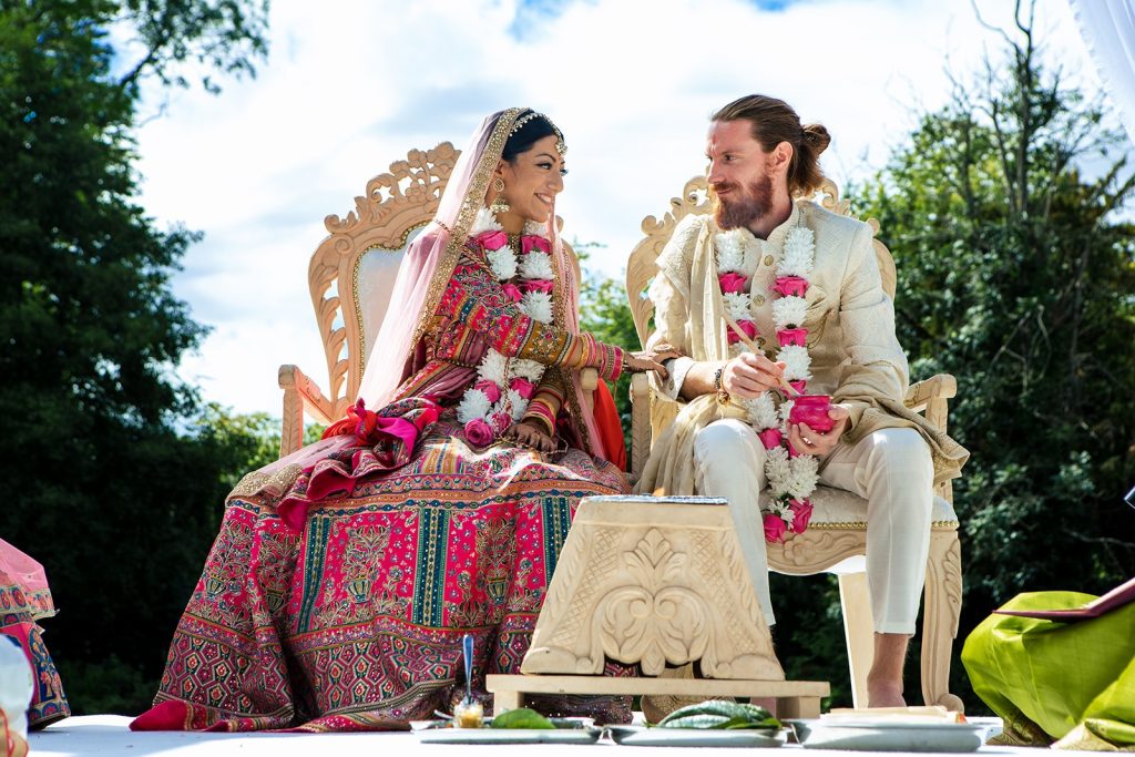 Wedding couple at St Albans glancing at each other