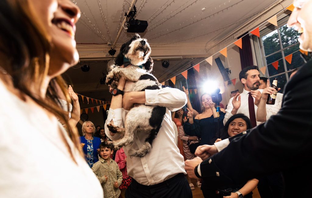 Bride and Groom dancing with their dog