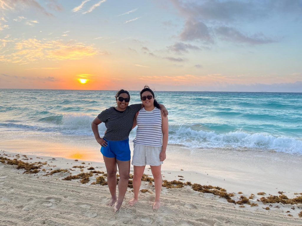 two women infront of sunrise
