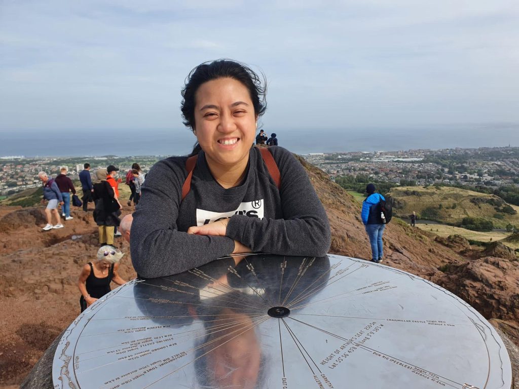 woman on top of Arthurs seat